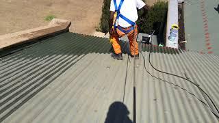 Pressure washing a roof