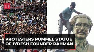 Bangladesh unrest Angry protesters loot PMs palace pummel statue of founder Mujibur Rahman