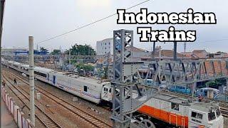 Trains In Indonesia Kereta Api Keluar Masuk Stasiun Jarinegara. Thamrin nine Tower Terlihat Jelas