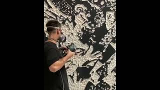 Artist Vhils carving using drills  #curation  #curator #art #artist #artists #carving #drilling