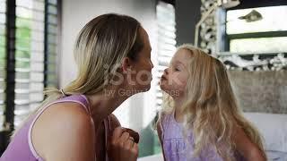 Cute Daughter Kisses Mommy  Stock Video