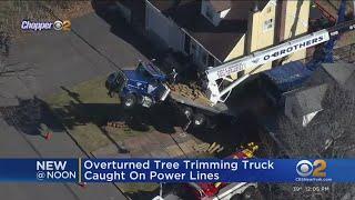 Tree trimming truck overturns in Cresskill