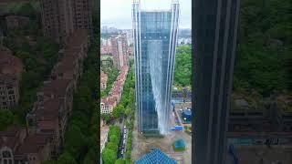 Skyscraper with a waterfall #skyscraper #architecture #dronevideo