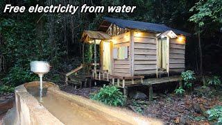 Build free hydroelectricity for wooden cabin in the forest in 5 minutes  Living off grid in forest