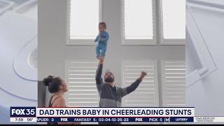 Video of dad doing cheerleading stunt with infant son goes viral on TikTok