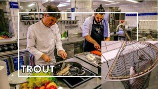 Chef Martin Herrmann prepares a freshly caught trout at 2 star Restaurant Le Pavillon in Dollenberg