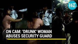 Viral Noida woman grabs security guard by collar Residential society incident disgusts netizens