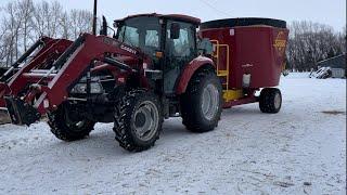 Using the little FARMALL to feed today