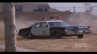 Hot babe cop chases down 75 Ford Econoline