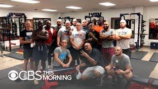 Football players shave their heads to honor coach diagnosed with cancer