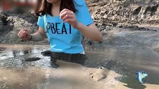White dress girl in mud with her blue T-shirt