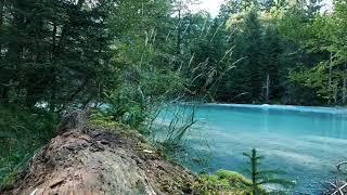 Beautiful Clear Blue Water River In Switzerland