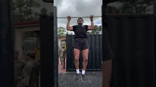 Green Berets evaluate Special Forces candidates on pull-ups during the Special Forces Challenge