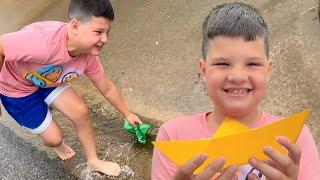 RAINY DAY FUN for Kids How to Make a Paper Boat to Play with in the Rain Crafts for Kids w Caleb