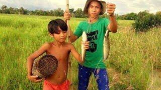 Cambodian Boys Fishing in the Field in the Rural Area