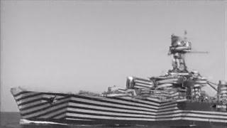 French cruiser Gloire in dazzle camouflage firing guns - 1944