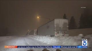 Life-threatening blizzard conditions in Sierra Nevada leave drivers stranded in feet of snow 