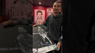 Joe Rogan gives Max Holloway sick painting of Justin Gaethje fight