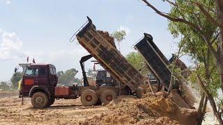 Amazing land fill Construction 10 wheel Dump Truck unloading Dirt to water pool