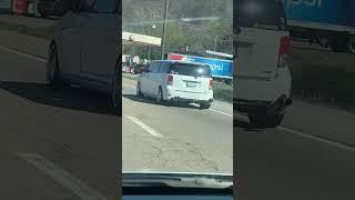 Custom stretched limo made from a Kia Soul spotted on the highway with fart can exhaust
