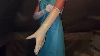 Nurse Alexa wearing Heavy Transparent Rubber Gloves and an Apron.