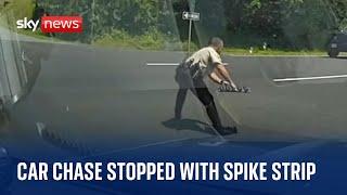 US Police officer stops car chase by bursting suspects tyres with spike strip