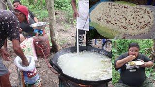 village boys cooking rice pulau and eating with chicken gravy food rural people living lifestyle