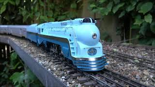 Blue Goose Hudson by Weaver with a Santa Fe train on a hot sunny day in the garden