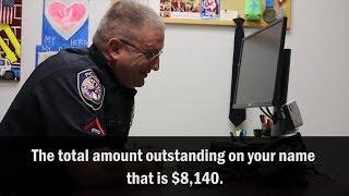 Watch Police Officer Hilariously Play Along With IRS Scammer