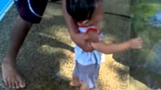 a father teaching his child how to breath underwater  psp