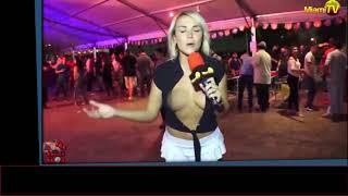 Half naked reporter interview people in a night club