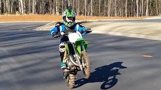 10 year old does max speed on a dirt bike. Kawasaki kx65 new