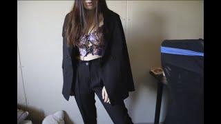 video in ASMR format dressing up black suit