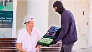 Robber Gives Away Cash Register Full Of Cash