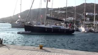 Successful sailboat docking in gusty wind Mykonos