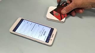 Using Square mobile phone and contactless card reader in action