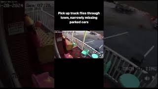 Pick up truck flies through town narrowly missing parked cars