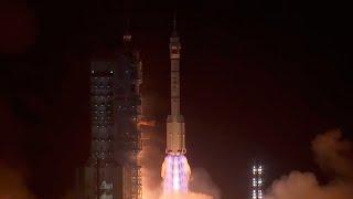 At the scene Chinas Shenzhou-18 manned spaceship blasts off