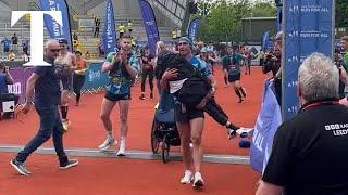 Emotional moment as Kevin Sinfield carries Rob Burrow over finish of Leeds marathon