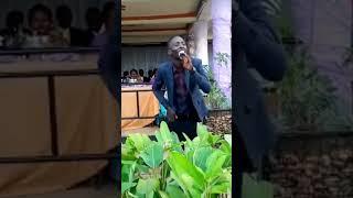 Michael Mugisha performing at wedding