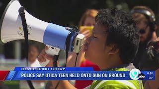 Police say Utica teen held on to gun on ground