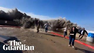 Unusually large waves hit the coast of California amid powerful storms