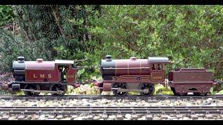 Hornby 0 Gauge Double heading LMS 0 4 0 Clockwork Tank and Tender locomotive with a passenger train