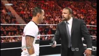 CM Punks hits Triple H with a pipe bomb after mic cutoffs
