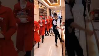 Chinese waiters serve food while skating