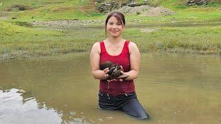 The life of a girl on the lake. Catching fish catching clams catching crabs to sell.