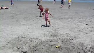 Connor Grace and Zoe running on the beach