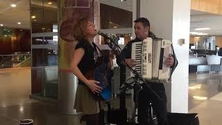 Accordion Virtuoso Paul Stanga with Emily McVicker at Seatac Airport