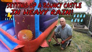 Setting Up A LARGE Adult Bouncy castle In A HEAVY RAIN Shower
