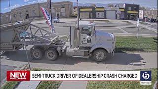 Driver of semi that crashed into Tooele dealership criminally charged